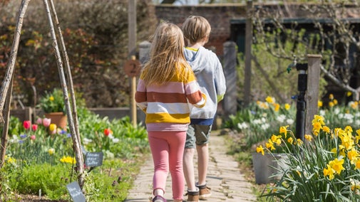 Children in the garden following an Easter trail
